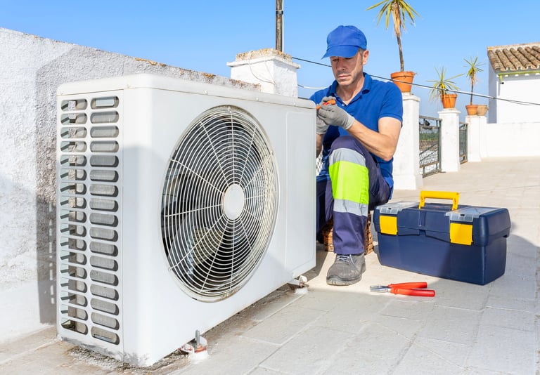 HVAC technician performing air conditioner condenser unit maintenance inspection outdoor on the rooftop. 24 hours emergency repair service for air conditioning and heating systems breakdowns and failures. Home insurance.